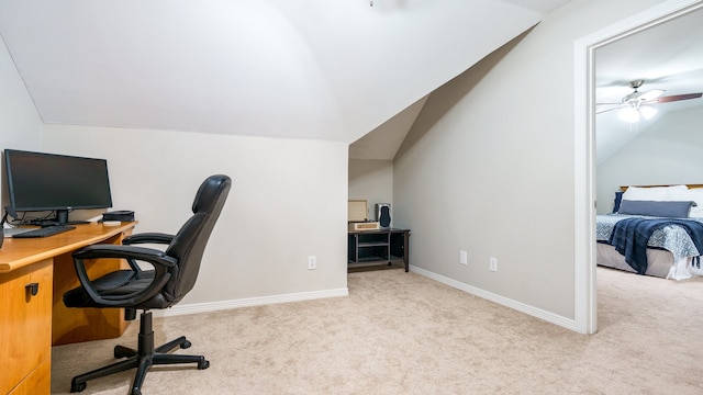 carpeted home office featuring ceiling fan and vaulted ceiling