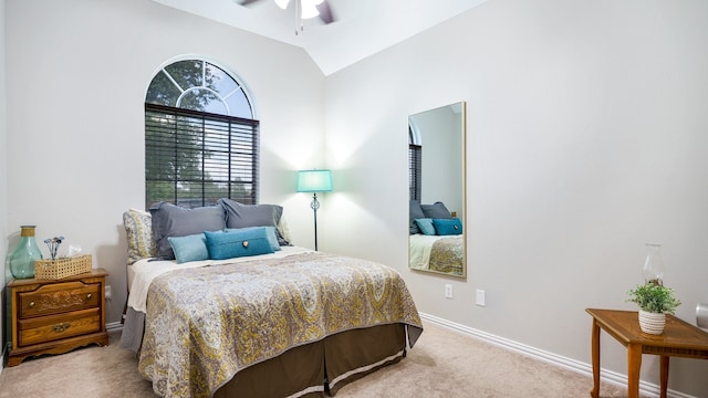 bedroom featuring ceiling fan, light colored carpet, and lofted ceiling