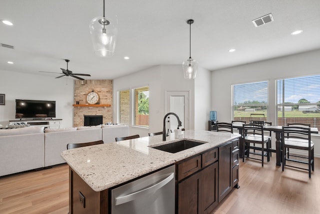 kitchen with dishwasher, pendant lighting, plenty of natural light, and sink