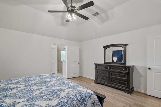 bedroom featuring ceiling fan, light hardwood / wood-style floors, and lofted ceiling