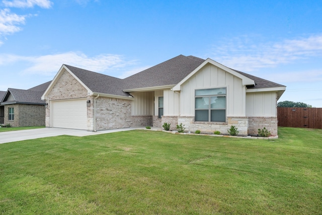 view of front facade featuring a front yard and a garage