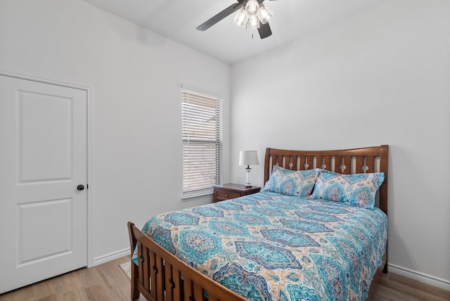 bedroom featuring ceiling fan and light hardwood / wood-style floors