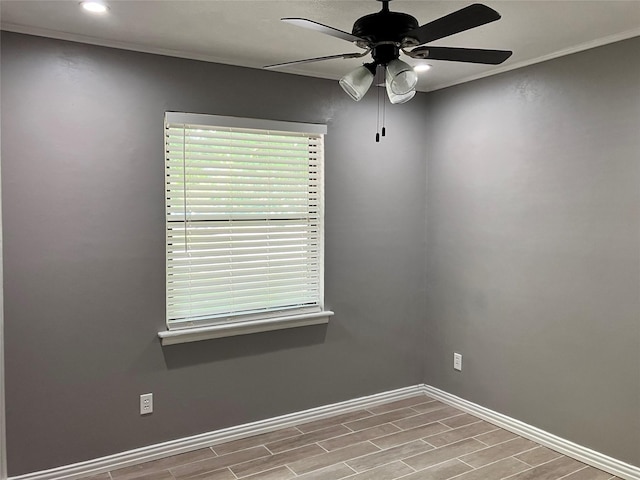 unfurnished room featuring crown molding and ceiling fan