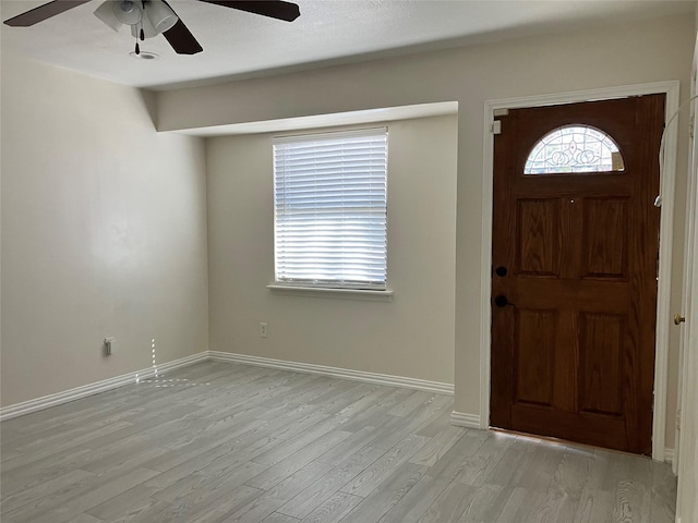 entrance foyer featuring light hardwood / wood-style flooring and ceiling fan