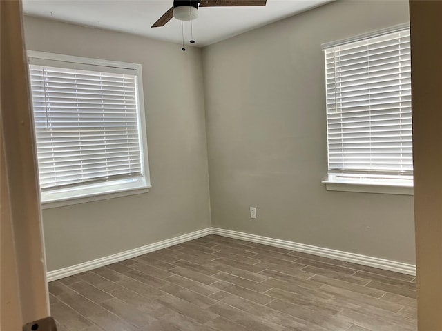 spare room with light hardwood / wood-style flooring and ceiling fan