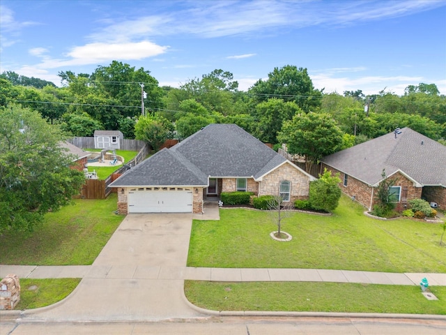 view of front of house featuring a front yard and a garage