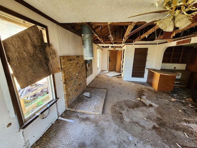 miscellaneous room featuring a textured ceiling and ceiling fan