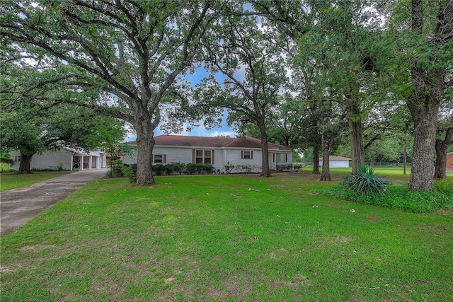 single story home with a front lawn and a garage