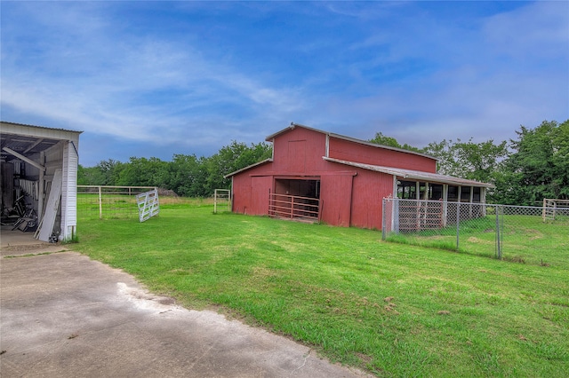 view of shed / structure featuring a lawn