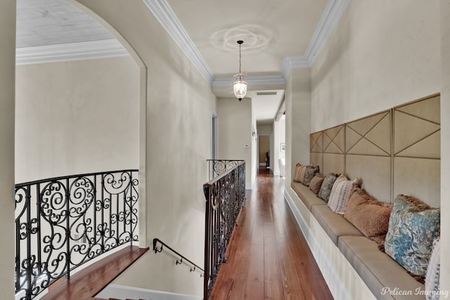 corridor with crown molding and dark hardwood / wood-style floors