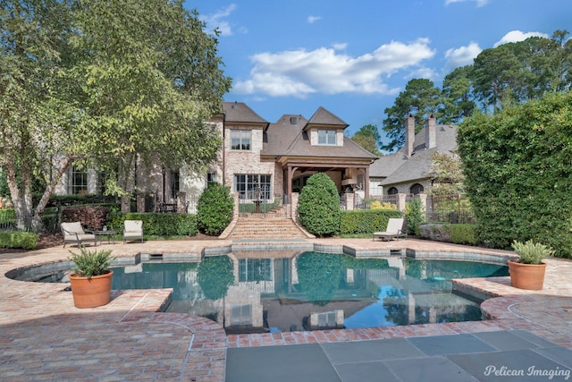 view of swimming pool with a patio area