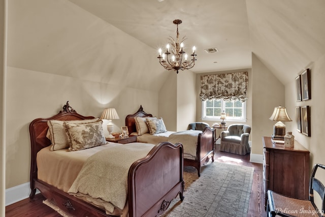 bedroom with a notable chandelier, vaulted ceiling, and dark hardwood / wood-style flooring