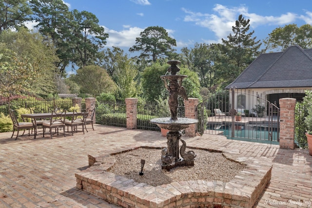 view of patio featuring a fenced in pool