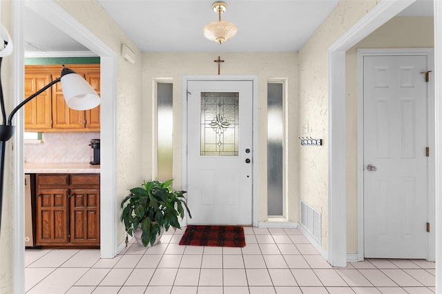 foyer entrance featuring light tile patterned flooring