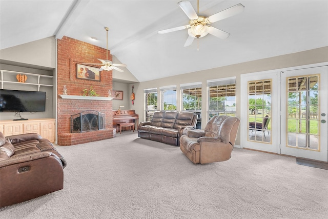 living room featuring vaulted ceiling with beams, carpet floors, a brick fireplace, and ceiling fan