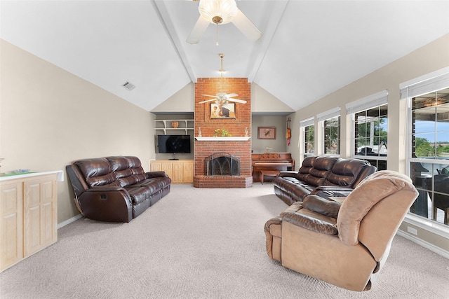 living room featuring vaulted ceiling with beams, carpet floors, a brick fireplace, and ceiling fan