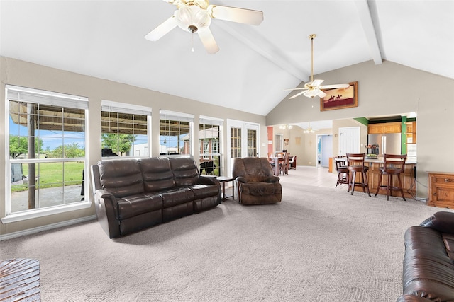 living room with beam ceiling, ceiling fan, carpet, and high vaulted ceiling