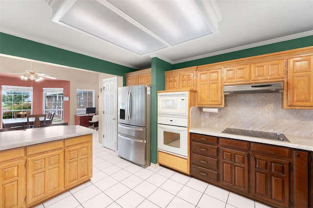 kitchen featuring backsplash, white appliances, ceiling fan, crown molding, and light tile patterned floors