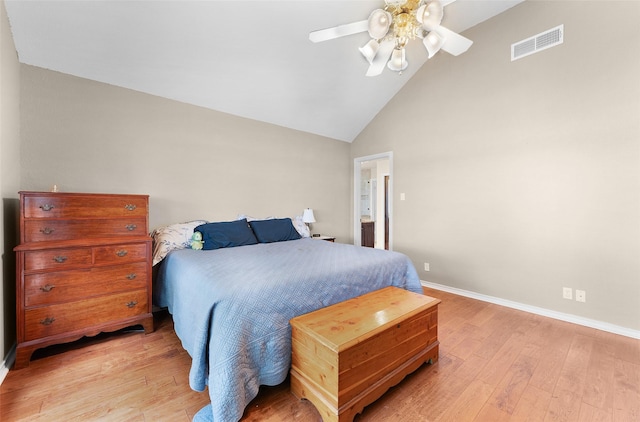 bedroom featuring ceiling fan, light hardwood / wood-style floors, and high vaulted ceiling