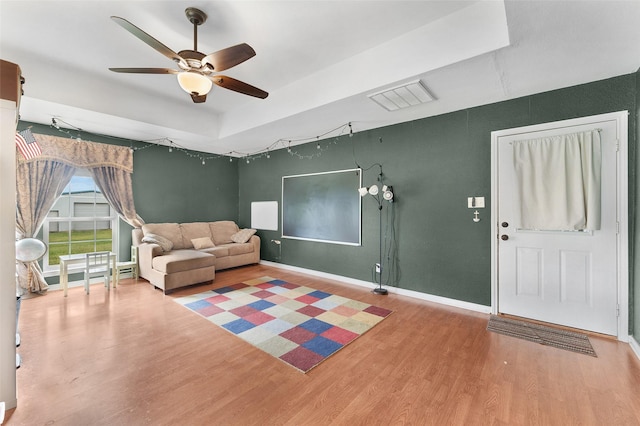 unfurnished living room featuring hardwood / wood-style flooring and ceiling fan