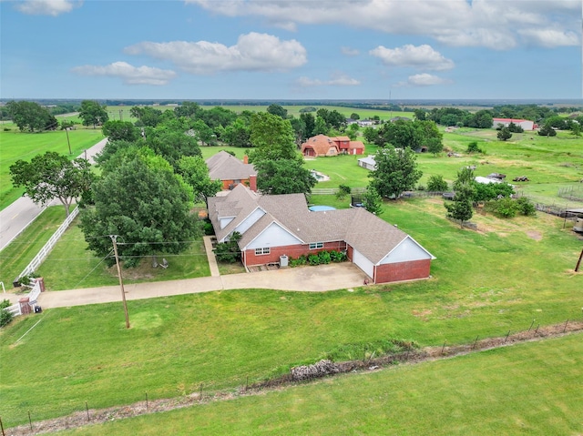 birds eye view of property with a rural view