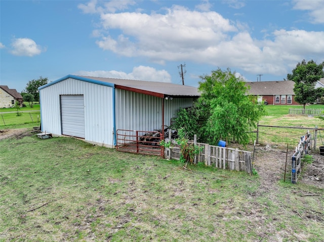 view of outbuilding featuring a yard