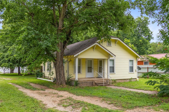 bungalow-style house featuring a front yard and a porch