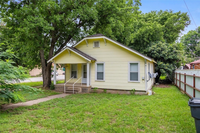 bungalow with a front lawn