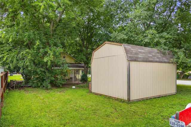 view of outdoor structure with a yard