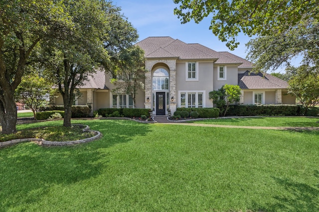 view of front of home with a front lawn