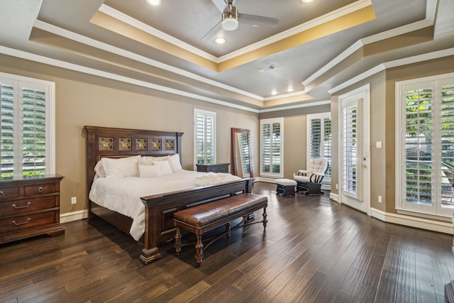 bedroom featuring ceiling fan, dark hardwood / wood-style flooring, ornamental molding, a tray ceiling, and access to outside