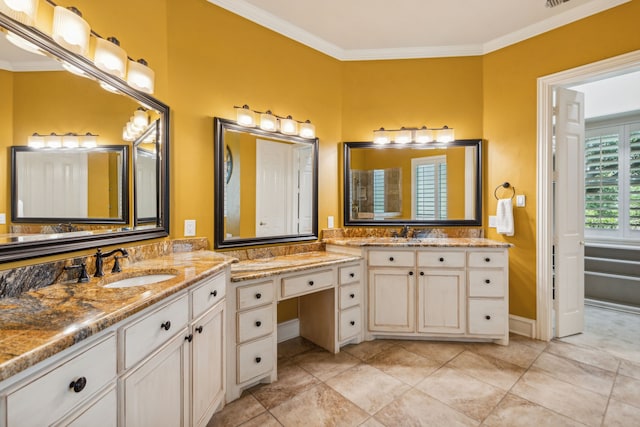 bathroom with ornamental molding and vanity