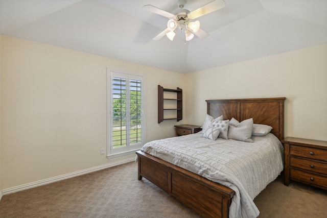 carpeted bedroom featuring ceiling fan and vaulted ceiling