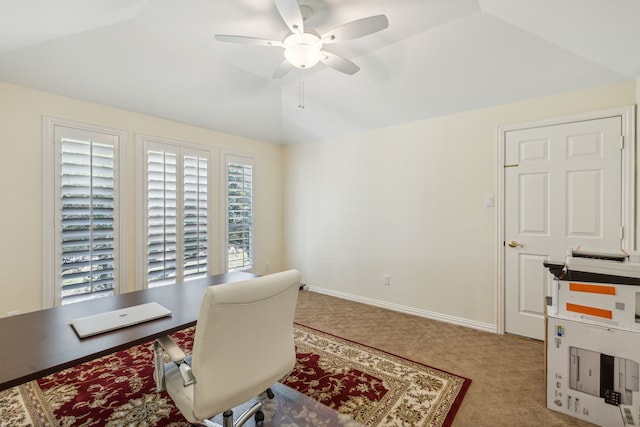 carpeted office featuring ceiling fan and lofted ceiling