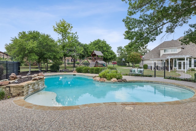 view of pool with a playground