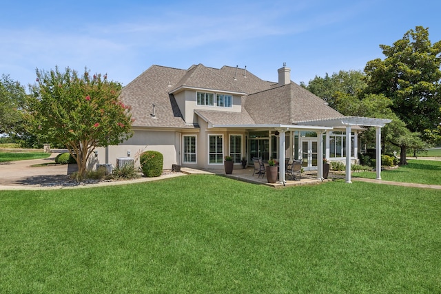 back of property featuring a patio, a lawn, and a pergola