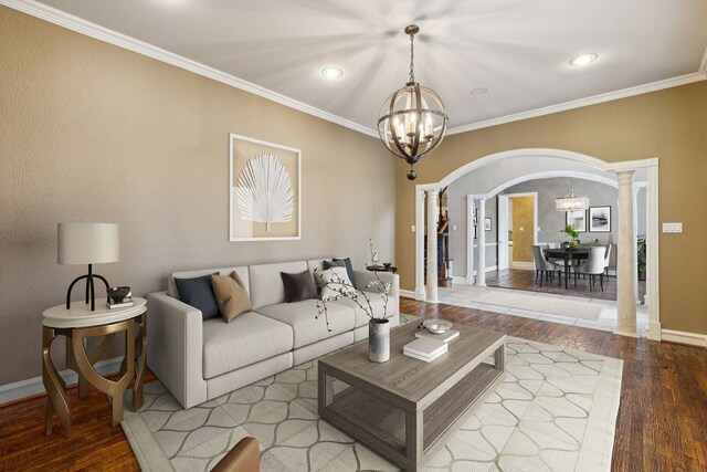 dining space featuring crown molding, a notable chandelier, and dark wood-type flooring