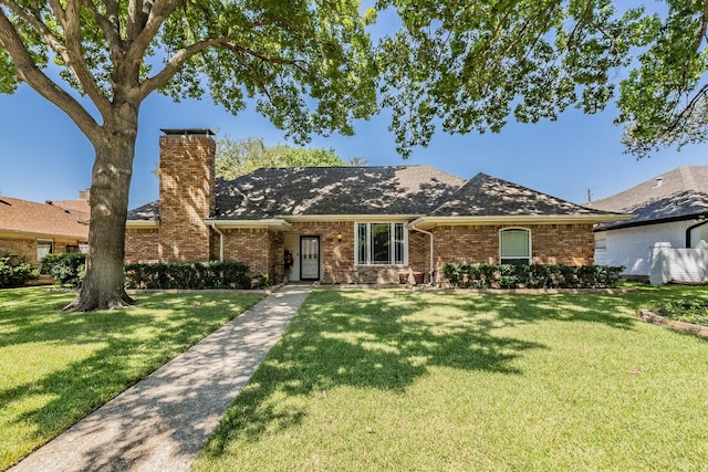 single story home with a front lawn