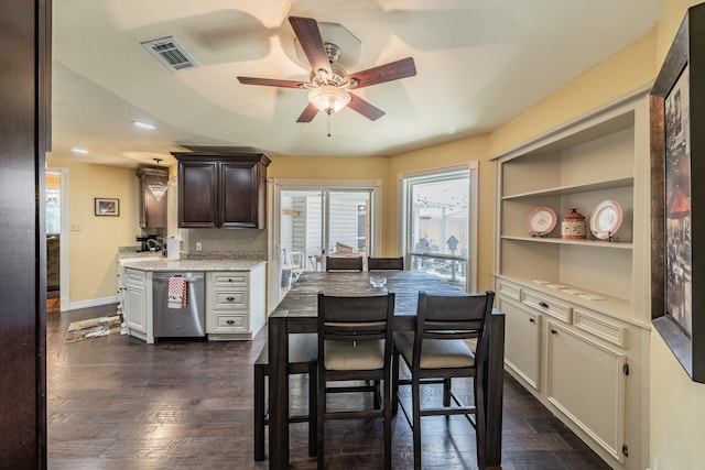 dining area featuring ceiling fan and dark hardwood / wood-style flooring