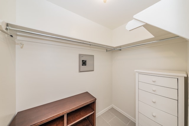 spacious closet with tile flooring