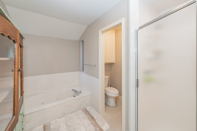 bathroom featuring tile floors, vaulted ceiling, plus walk in shower, and toilet