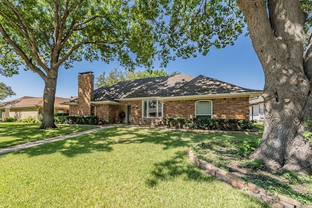 ranch-style home with a front yard