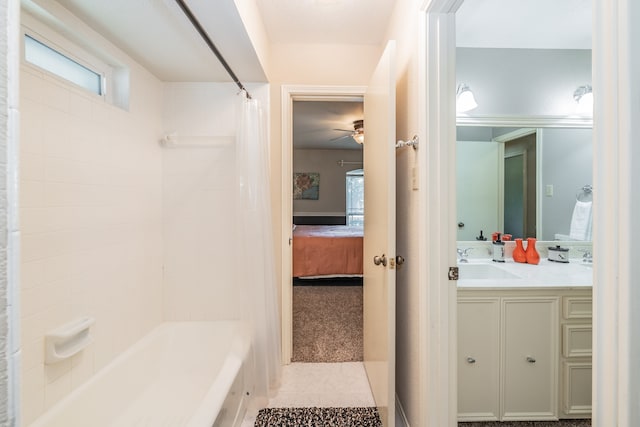 bathroom with shower / bathtub combination with curtain, vanity, ceiling fan, and tile floors