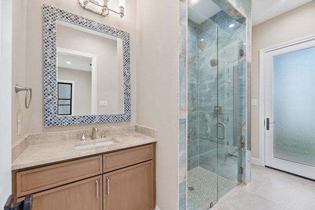 bathroom with vanity and walk in shower