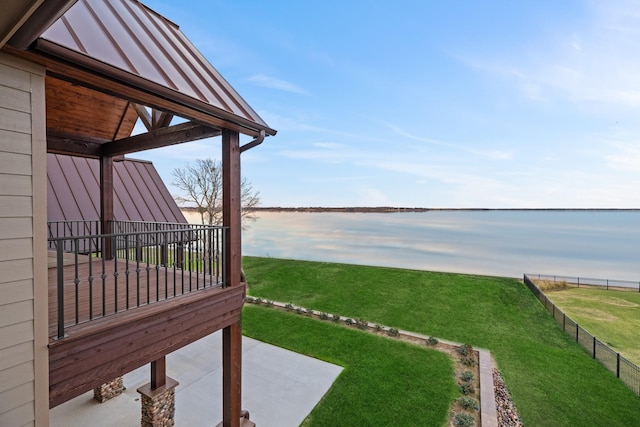 view of yard with a patio and a water view