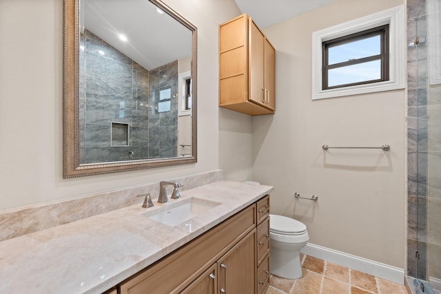 bathroom featuring an enclosed shower, vanity, lofted ceiling, and toilet