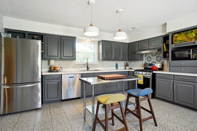 kitchen with light tile flooring, backsplash, gray cabinetry, appliances with stainless steel finishes, and sink