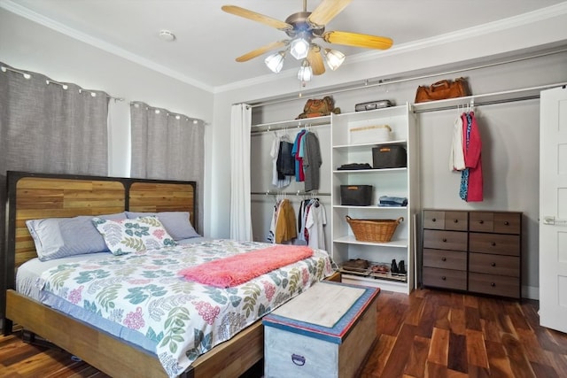 bedroom featuring ornamental molding, dark hardwood / wood-style floors, and ceiling fan