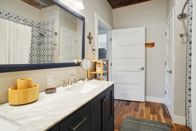 bathroom featuring vanity and hardwood / wood-style flooring