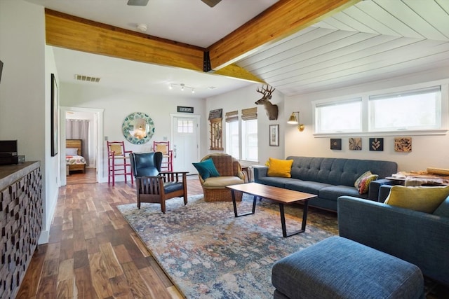 living room with beamed ceiling, ceiling fan, and dark hardwood / wood-style floors